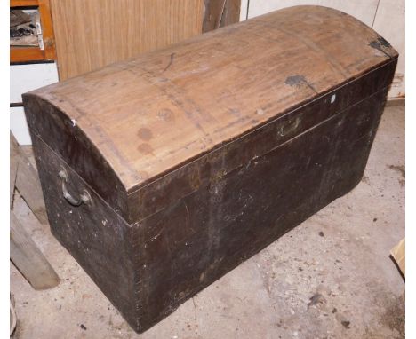 A 19thC mahogany dome top trunk, with brass military style inset lid handle, and two carrying handles.
