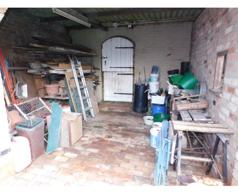 The contents of Arch No. 4, being various hand tools, workmate, terracotta plant pots, plastic tubs, drain rods, garden kneel