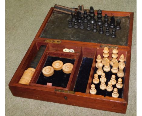 A Staunton chess set, and draughts in a mahogany compendium box. 