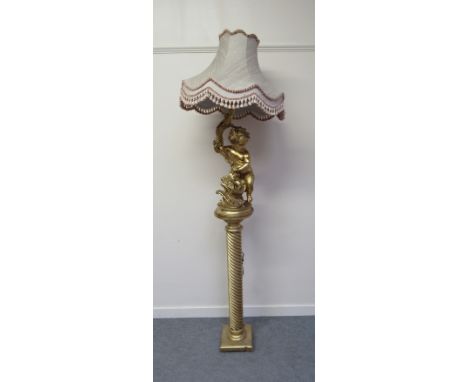 A gilded cherub lamp on twisted pedestal base, approx 205cm tall
