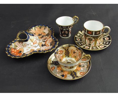 A large collection of assorted Royal Crown Derby wares including cups and saucers