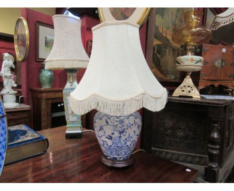 A blue and white ceramic lamp with shade with Moorcroft influence, 51cm tall 