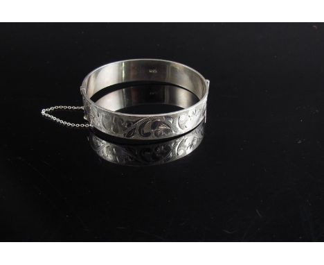 A silver engraved stiff hinge bangle, Birmingham