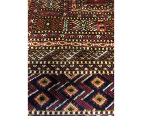 A modern red ground Bokhara carpet, 2.30m x 1.60m
