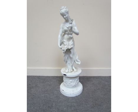 A white-painted, cast metal, lamp base of a classical lady holding a basket of fruit, 62cm tall