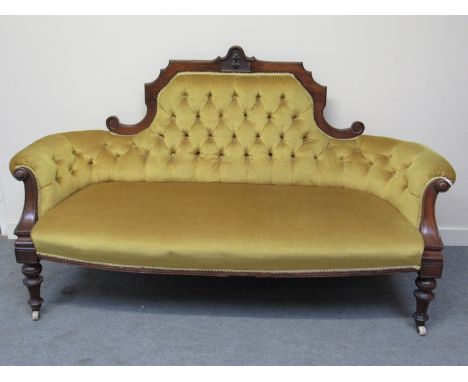 A Victorian button back sofa with rich yellow velour upholstery, 167cm long
