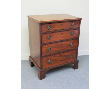 A Victorian mahogany chest of small proportions with four drawers, oval plate handles raised on bracket feet, 70cm x 63cm x 4