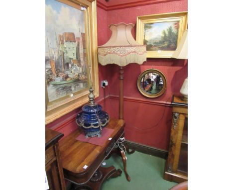 A mahogany turned columned standard lamp stand on cabriole legs with original 1920's shade 