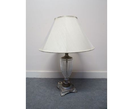 A glass and gilt based table lamp on square base with cream shade, 51cm tall