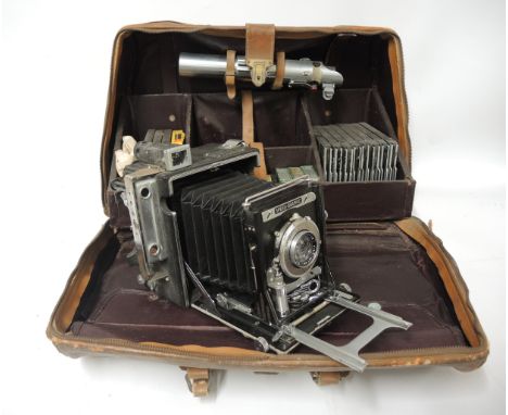 Graflex Speed Graphic camera outfit in original fitted leather case, with accessories14cm wide x 17cm high. Condition best sh