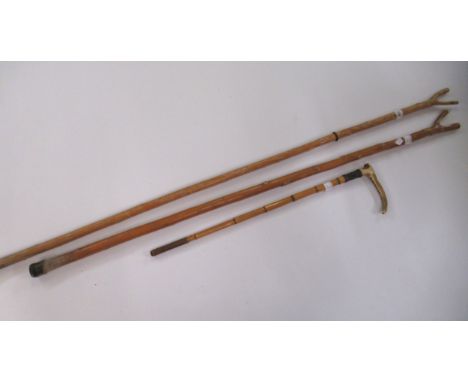 Silver collared bamboo riding crop with antler handle (lacking leather), together with two tall walking sticks