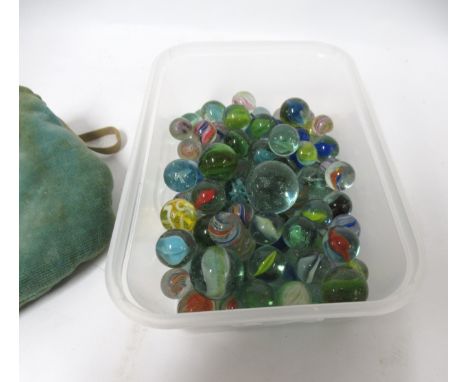 Bag containing a collection of various vintage marbles