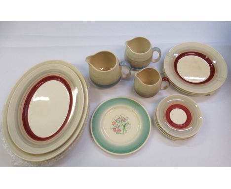 Quantity of 1930s Susie Cooper dinnerware including a set of three graduated pottery jugs