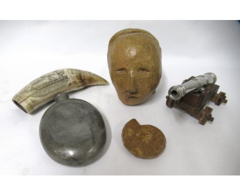 Miniature wooden and metal gun carriage, reproduction scrimshaw, pewter hip flask, fossilized ammonite and a stoneware double