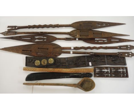 Quantity of native carved hardwood canoe paddles and other items of ethnographica