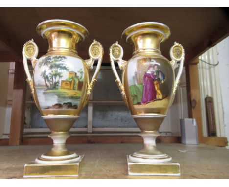 Pair of 19th Century Paris porcelain two handled pedestal vases, painted with panels of figures and landscapes on a gilt and 