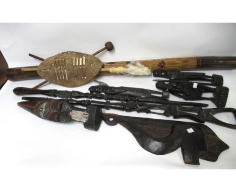 Quantity of various African tribal wooden items including an African staff, small shield and a didgeridoo