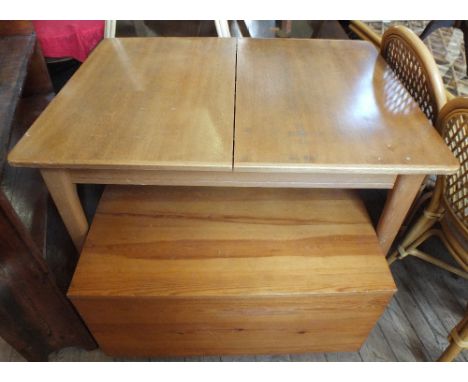 A modern Beechwood extending dining table, a trunk and a Pine stool