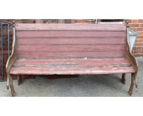 A garden bench with cast iron giraffe ends