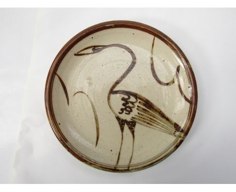 A Wenford Bridge Pottery plate, brushwork tenmoku bird decoration, possibly by Michael Cardew. Pottery seal only. 24cm diamet