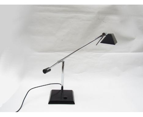 A black painted metal desk lamp with adjustable chrome plated metal arms 