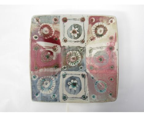 MARIANNE DE TREY (1913-2016) A studio pottery square form dish, painted squares with floral and circular detail, impressed ma