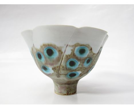MARIANNE DE TREY (1913-2016) A studio porcelain flared pedestal bowl with shaped waved rim, decorated with painted peacock fe
