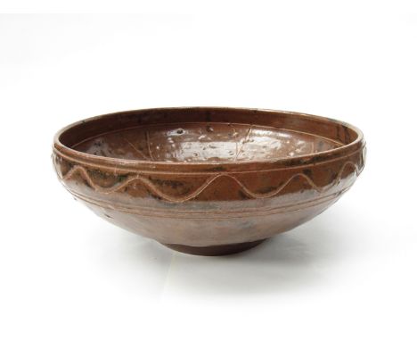 MICHAEL CARDEW (1901-1983) (ARR) A Wenford Bridge Pottery bowl, brown glaze with incised line and wave detail. Impressed pott