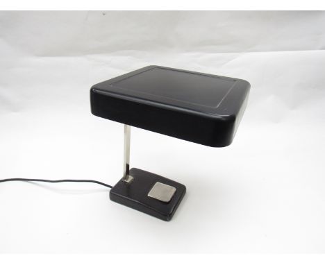 A black painted metal desk lamp with adjustable chrome plated metal arm