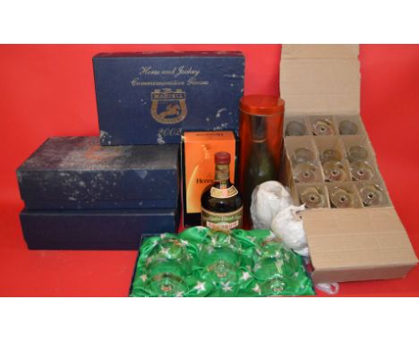 3 bottles of Cognac: Hennessy, Remy Martin and Drambuie. Together with a dozen Hennessy Cognac glasses.And 3 boxed sets of Ma