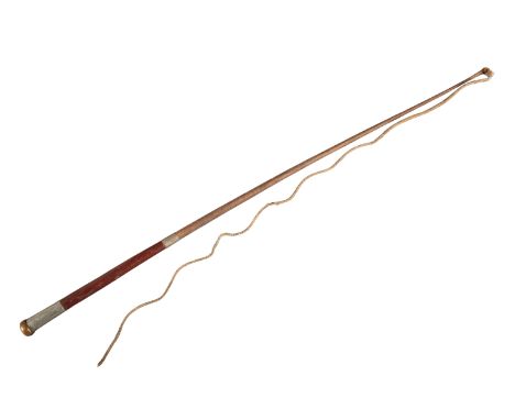 CRAWLEY & SON, PETERBOROUGH: AN EDWARDIAN DEALER'S WHIPwith nickel silver collar, leather grip, plaited leather thong and sha