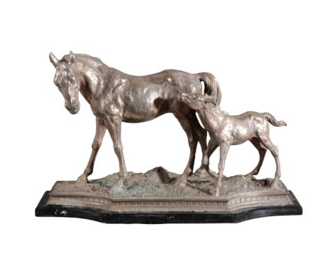 A SILVER-PLATED GROUP OF MARE AND FOALlate 19th century, on a shaped black marble base, 24cm high x 57cm longProvenance: From