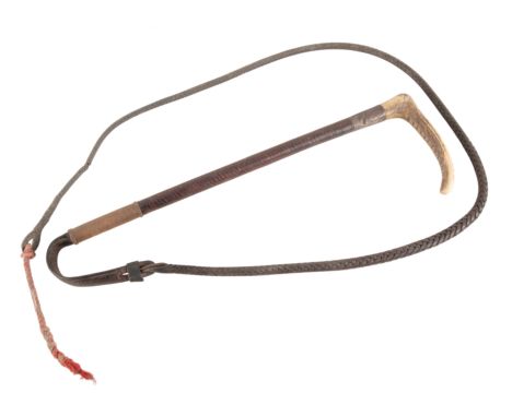 A SILVER HALLMARKED GENTLEMAN'S RIDING CROPwith an antler handle over a Swaine hallmarked collar inscribed 'BJ ROYTE - BULLOC