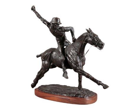 A BRONZE SCULPTURE OF A POLO PLAYER ON HORSEBACKon an oval mahogany base, signed to the base of the bronze "T. Holland 1971" 