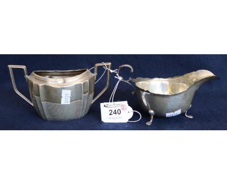 Silver sauceboat with card cut edge and scrolled handle on paw feet. Chester hallmarks, 2.85 troy ozs approx. Together with a