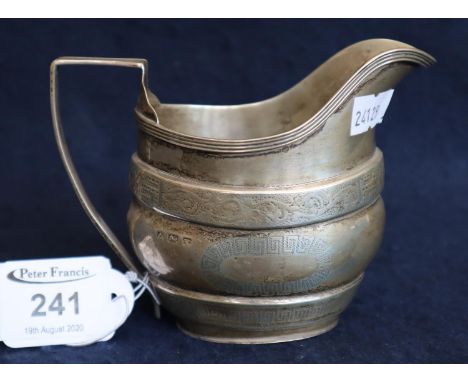 19th Century silver helmet shaped cream jug with geometric and foliate engraved decoration. Birmingham hallmark, 4 troy ozs a