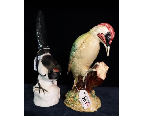 Beswick pottery woodpecker 1218, together with a Russian USSR ceramic study of a magpie. (2)(B.P. 21% + VAT) 