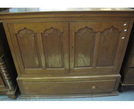 19th Century Welsh oak two door blind panelled press cupboard having ogee pointed and fielded panels with under drawer (the t