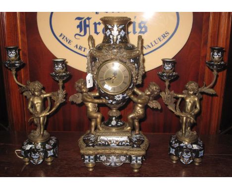 Classical design three piece clock garnitures, the quartz clock movement with an urn shaped vase and ribbons, surmounted with