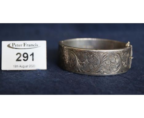 Silver engraved bangle. (B.P. 21% + VAT) 