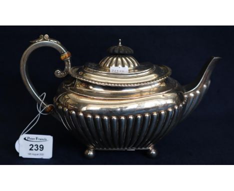 Silver half lobed baluster teapot with scrolled insulated handle and ebony knop. Sheffield hallmarks, 18 troy ozs approx. (B.
