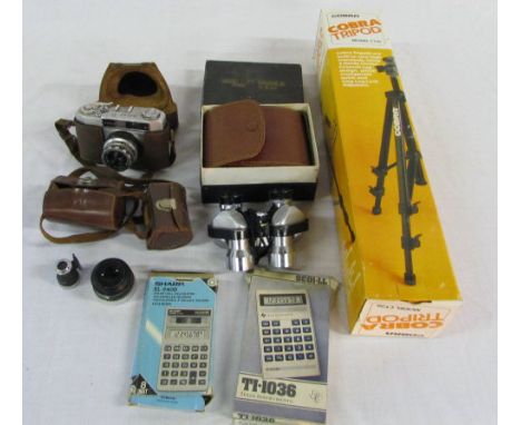 Atlas Camera, Zenith 7 x 25 binoculars, Cobra tripod, calculators etc