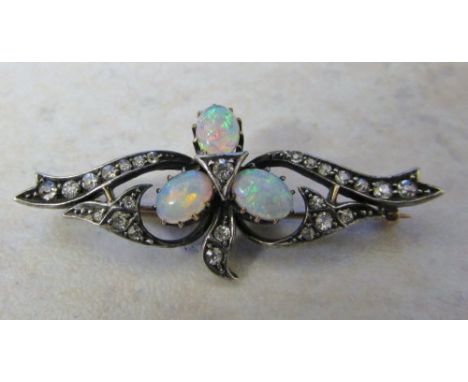 Tested as 18ct diamond and opal brooch