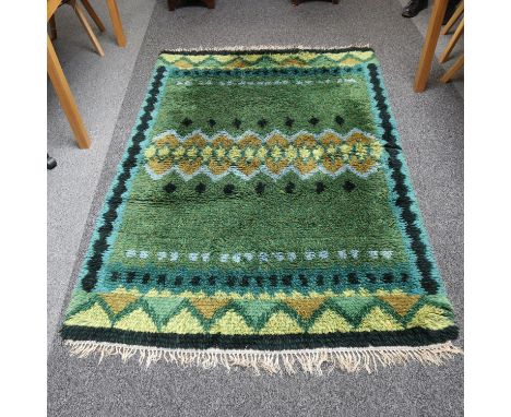A large Scandinavian Rya rug, long wool pile, in green yellow and blue, 208cm x 144cmSome marks to underside or rug, no visib