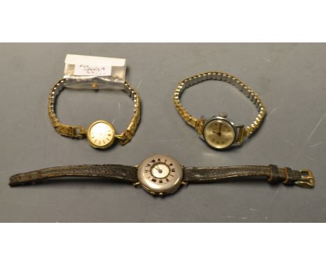 An Omega lady's wristwatch; a silver half Hunter trench wristwatch; a Timex cased wristwatch (3)