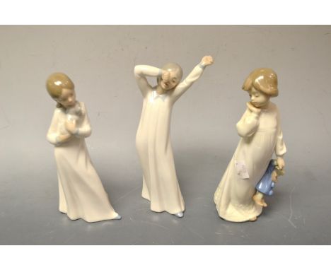 A Nao figure of a young  child, boxed; others, boxed (3)