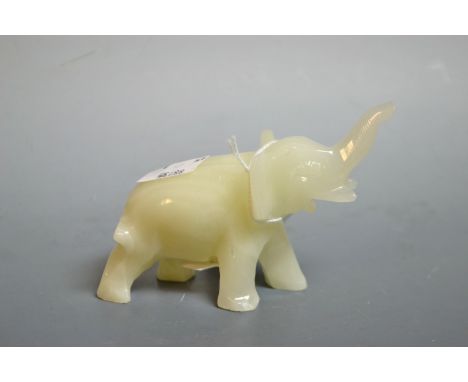 A Chinese pale celadon jade carving, of an elephant, 6.5cm high, 8cm long