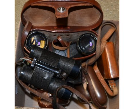 A pair of Leitz Wetzlar field glasses, cased; a pair of Swift binoculars, 8.5 x 44, cased; a Zeiss Ikon 35mm camera, cased; a