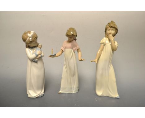 A Nao figure of a girl and her doll, boxed; others, boxed (3)