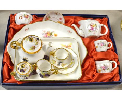 A Royal Crown Derby miniature tea set, first quality, boxed; a Royal Doulton hand painted miniature tea set